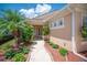 Inviting front entrance with a pathway leading to the front door and lush landscaping at 2425 Laurel Glen Dr, Lakeland, FL 33803