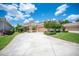 Charming single-story home featuring a well manicured lawn and a spacious driveway at 2425 Laurel Glen Dr, Lakeland, FL 33803