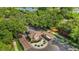 The beautiful guard house at the front entrance to the community with manicured landscaping and brick pavers at 2425 Laurel Glen Dr, Lakeland, FL 33803