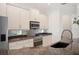 Well-equipped kitchen features granite counters, stainless steel appliances, and white cabinets at 2425 Laurel Glen Dr, Lakeland, FL 33803
