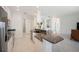 Spacious kitchen with granite island and stainless appliances opens to living area at 2425 Laurel Glen Dr, Lakeland, FL 33803
