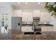 Modern kitchen featuring granite countertops, stainless steel appliances, and bright white cabinetry at 2425 Laurel Glen Dr, Lakeland, FL 33803