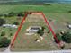 Aerial view of land and home showcasing property lines in a rural setting at 246 Quail Run, Frostproof, FL 33843