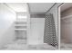 Bathroom featuring a shower with a black and white curtain and shelves at 246 Quail Run, Frostproof, FL 33843