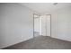 Cozy carpeted bedroom with an ensuite bath and ample natural light at 246 Quail Run, Frostproof, FL 33843