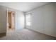Carpeted bedroom with a window and ensuite bath at 246 Quail Run, Frostproof, FL 33843