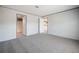 Bedroom with neutral colored walls and carpet, and ensuite bath at 246 Quail Run, Frostproof, FL 33843