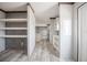 Bright entryway boasting wood-look floors and built in shelving on the main level at 246 Quail Run, Frostproof, FL 33843