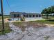 Exterior of a single-story home with siding and a wood porch at 246 Quail Run, Frostproof, FL 33843