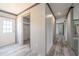Hallway boasts wood-look floors and white trim, leading to secondary rooms at 246 Quail Run, Frostproof, FL 33843