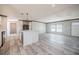 Open kitchen space with white island, appliances, and lots of natural light at 246 Quail Run, Frostproof, FL 33843