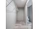 View of a walk-in closet that enters into the bathroom featuring a toilet at 246 Quail Run, Frostproof, FL 33843