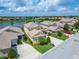 An aerial view showcases this charming home near the lake with mature landscaping at 2464 Laurel Glen Dr, Lakeland, FL 33803
