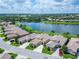 An aerial view captures the beauty of this community with a lake, mature trees, and manicured lawns at 2464 Laurel Glen Dr, Lakeland, FL 33803