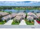 An aerial view of a lakeside community featuring well-maintained landscaping and serene water views at 2464 Laurel Glen Dr, Lakeland, FL 33803