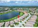 Beautiful lakeside community with mature trees, manicured lawns, and stunning water views at 2464 Laurel Glen Dr, Lakeland, FL 33803