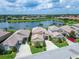 Lakeside homes in a community offering well-manicured lawns, mature landscaping, and serene water views at 2464 Laurel Glen Dr, Lakeland, FL 33803