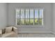Light-filled room with window shutters, neutral walls, and plush carpeting at 2464 Laurel Glen Dr, Lakeland, FL 33803