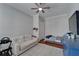 Bedroom with neutral gray walls, ceiling fan, and closet space at 2464 Laurel Glen Dr, Lakeland, FL 33803
