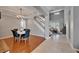 Well-lit dining area adjacent to staircase and living area at 2464 Laurel Glen Dr, Lakeland, FL 33803