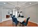Dining room with wood floors, decorative chandelier, and modern decor at 2464 Laurel Glen Dr, Lakeland, FL 33803