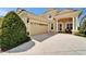 Well maintained home with a two car garage, neutral colors, and manicured front yard at 2464 Laurel Glen Dr, Lakeland, FL 33803