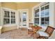 Charming front porch with seating area and a 'welcome' mat at 2464 Laurel Glen Dr, Lakeland, FL 33803