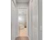 Hallway view of a stylish bathroom with a soaking tub and tiled shower at 2464 Laurel Glen Dr, Lakeland, FL 33803