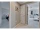 Hallway view with doorways leading to bedrooms, neutral walls, and carpeted floor at 2464 Laurel Glen Dr, Lakeland, FL 33803