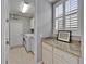 Efficient laundry room with modern washer, dryer, and ample counter space at 2464 Laurel Glen Dr, Lakeland, FL 33803