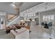 Bright living space featuring tiled floors, an open floor plan, stairs, and natural light at 2464 Laurel Glen Dr, Lakeland, FL 33803