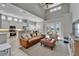 Open floor plan with vaulted ceilings, modern lighting, and easy access to the kitchen at 2464 Laurel Glen Dr, Lakeland, FL 33803