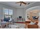 Bright office space featuring wood floors, a ceiling fan, two desks, and natural light from a window at 2464 Laurel Glen Dr, Lakeland, FL 33803