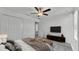 Bright bedroom with ceiling fan and closet, with media center and dark bench at 2546 Red Egret Dr, Bartow, FL 33830