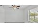 This bedroom has a new ceiling fan and a window with natural light at 2546 Red Egret Dr, Bartow, FL 33830