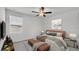 Bedroom featuring a ceiling fan, a bedside table, and a padded bench at 2546 Red Egret Dr, Bartow, FL 33830