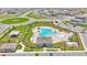 Aerial view of a community pool, playground, cabana and manicured landscaping at 2546 Red Egret Dr, Bartow, FL 33830