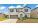 Charming two-story home featuring a neutral color palette and well-maintained landscaping at 2546 Red Egret Dr, Bartow, FL 33830