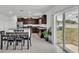 Bright kitchen with stainless appliances, granite countertops, an island and access to a backyard patio at 2546 Red Egret Dr, Bartow, FL 33830
