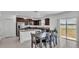 Bright kitchen featuring stainless appliances, granite countertops, and tile flooring at 2546 Red Egret Dr, Bartow, FL 33830