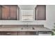 This kitchen boasts a stainless steel sink, granite countertops and matching cabinetry at 2546 Red Egret Dr, Bartow, FL 33830