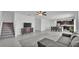 Open-concept living room featuring tile floors, a modern couch, and an adjacent dining and kitchen area at 2546 Red Egret Dr, Bartow, FL 33830