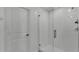 The shower in this bathroom features glass doors and white subway tile at 2546 Red Egret Dr, Bartow, FL 33830