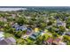 Home nestled in lush neighborhood with mature trees and easy access to nearby lake at 2731 Coventry Ave, Lakeland, FL 33803