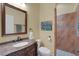 An elegant bathroom features a carved vanity, stylish fixtures, and a walk-in shower at 2731 Coventry Ave, Lakeland, FL 33803