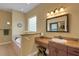 Bathroom featuring granite counters, a vanity, and a large soaking tub with a glass block window at 2731 Coventry Ave, Lakeland, FL 33803