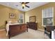 Primary bedroom with neutral carpet, ceiling fan and furniture at 2731 Coventry Ave, Lakeland, FL 33803