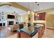 Gourmet kitchen open to living room featuring granite counters and dark wood cabinetry at 2731 Coventry Ave, Lakeland, FL 33803