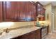 Gourmet kitchen with stainless steel appliances, granite countertops, and custom cabinetry at 2731 Coventry Ave, Lakeland, FL 33803