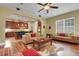 Open-concept living space with kitchen, hardwood floors, and lots of natural light at 2731 Coventry Ave, Lakeland, FL 33803